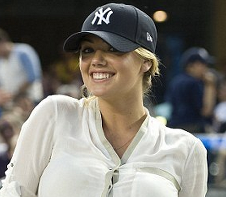 Kate Upton cheers for the Yankees in tiny white shorts and can't help but  pose up a storm in the stands