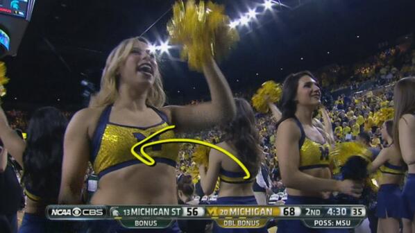 CBS arrow points directly at UM cheerleader's boob