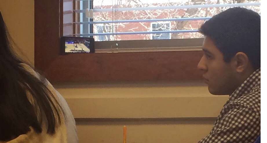 NCAA Tournament Kid Watches in class
